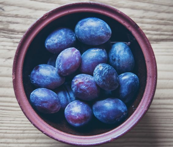 Latest Sale interior design, plums, purple bowl on wooden surface